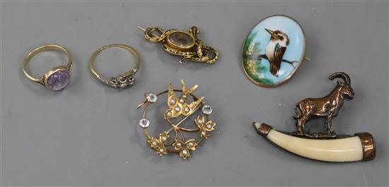 An early Victorian yellow metal mourning brooch, two rings, two pendants, two brooches and a pendant.